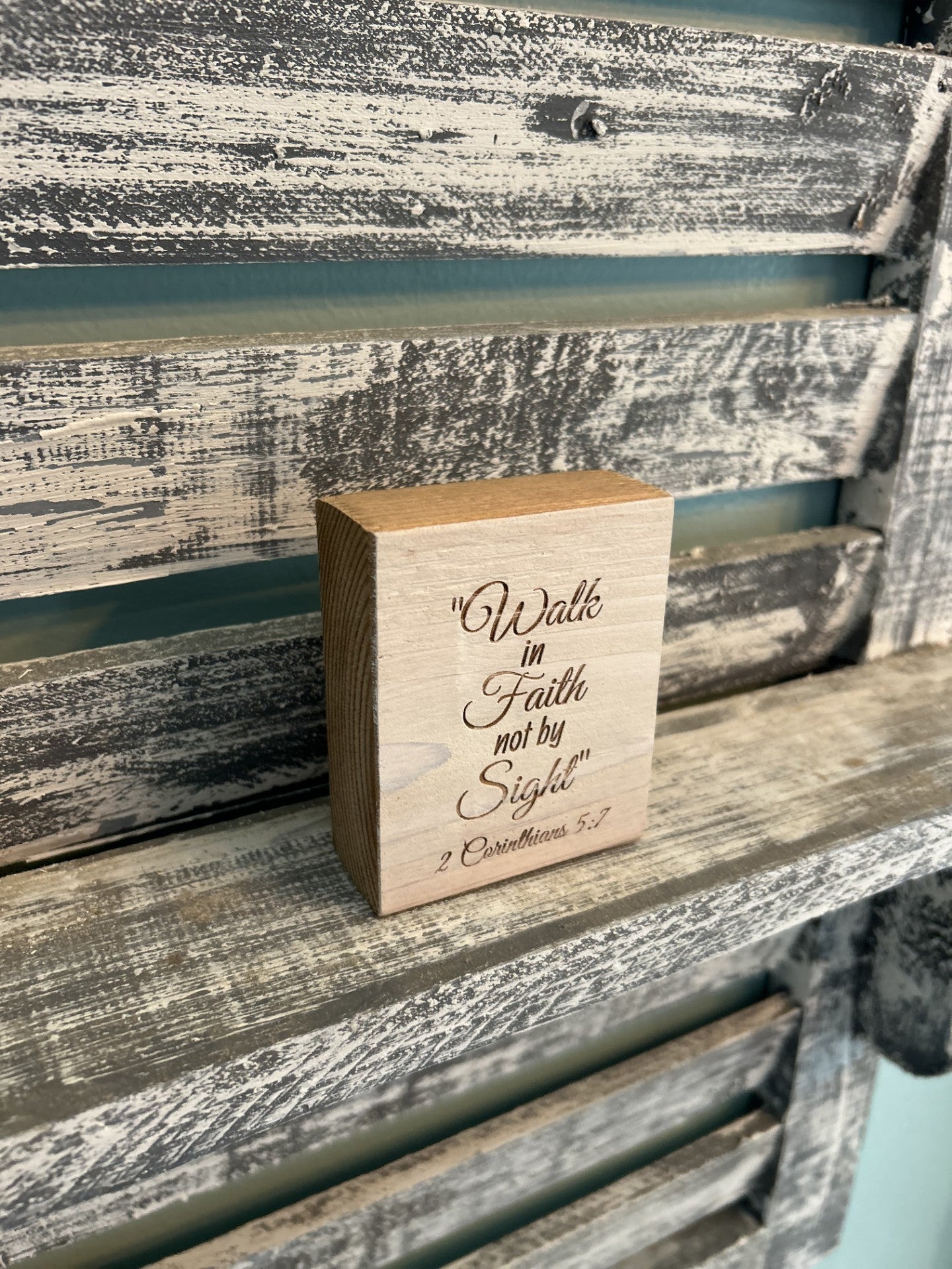 Handcrafted wood block with 'Walk in Faith not by Sight' on rustic shelf, Port Royal Woodworks.