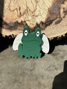 Handmade wood-carved green frog figurine with white angel wings