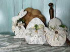 Handmade, hand-painted white crackle-style decorative egg with white ribbon, ideal for home decor, Easter, or Spring settings.