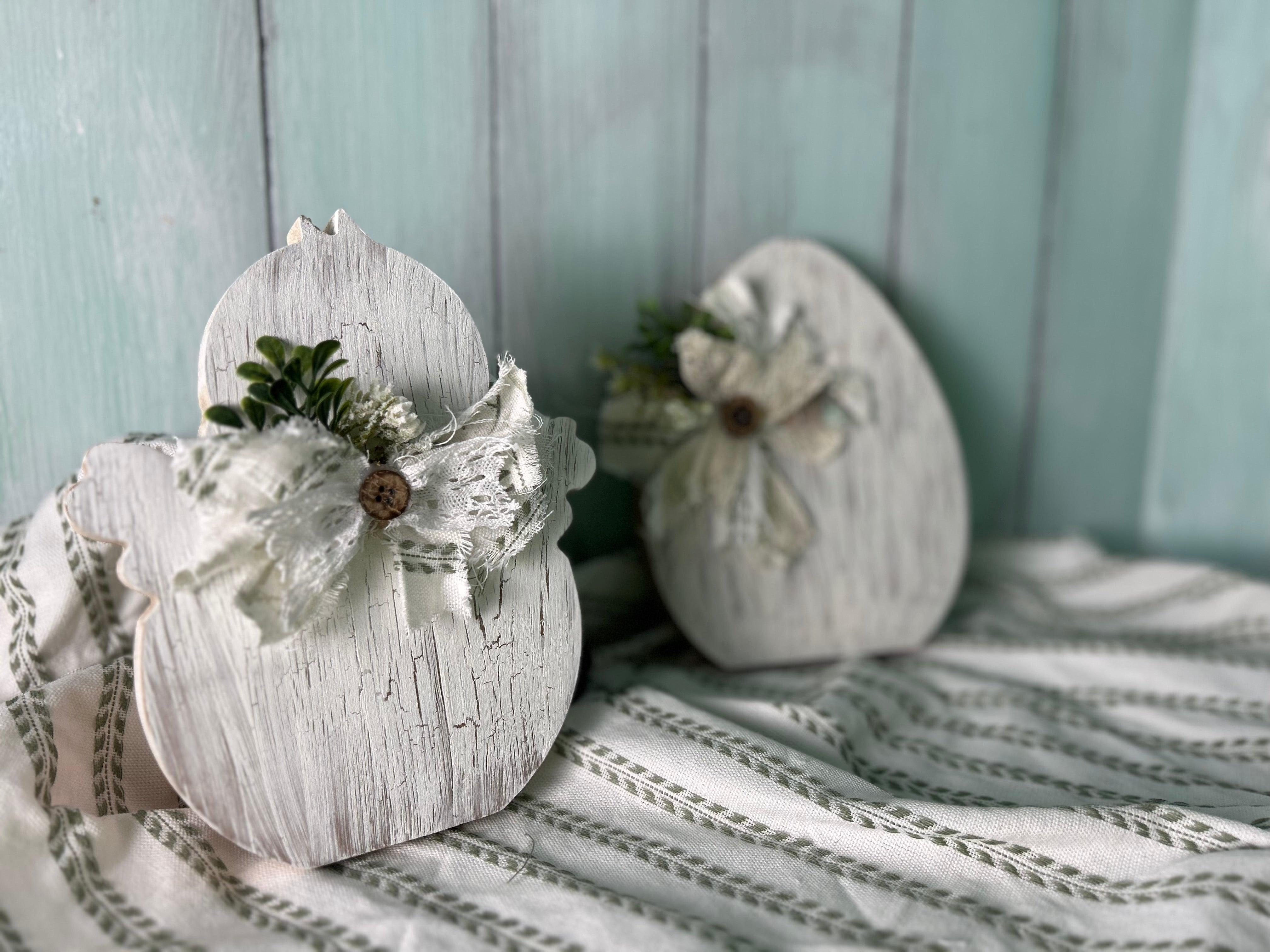 Handmade, hand-painted white crackle-style decorative chick with white ribbon, ideal for home decor, Easter, or Spring settings.