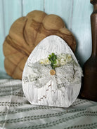 Handmade, hand-painted white crackle-style decorative egg with white ribbon, ideal for home decor, Easter, or Spring settings.