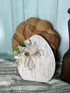 Handmade, hand-painted white crackle-style decorative egg with white ribbon, ideal for home decor, Easter, or Spring settings.