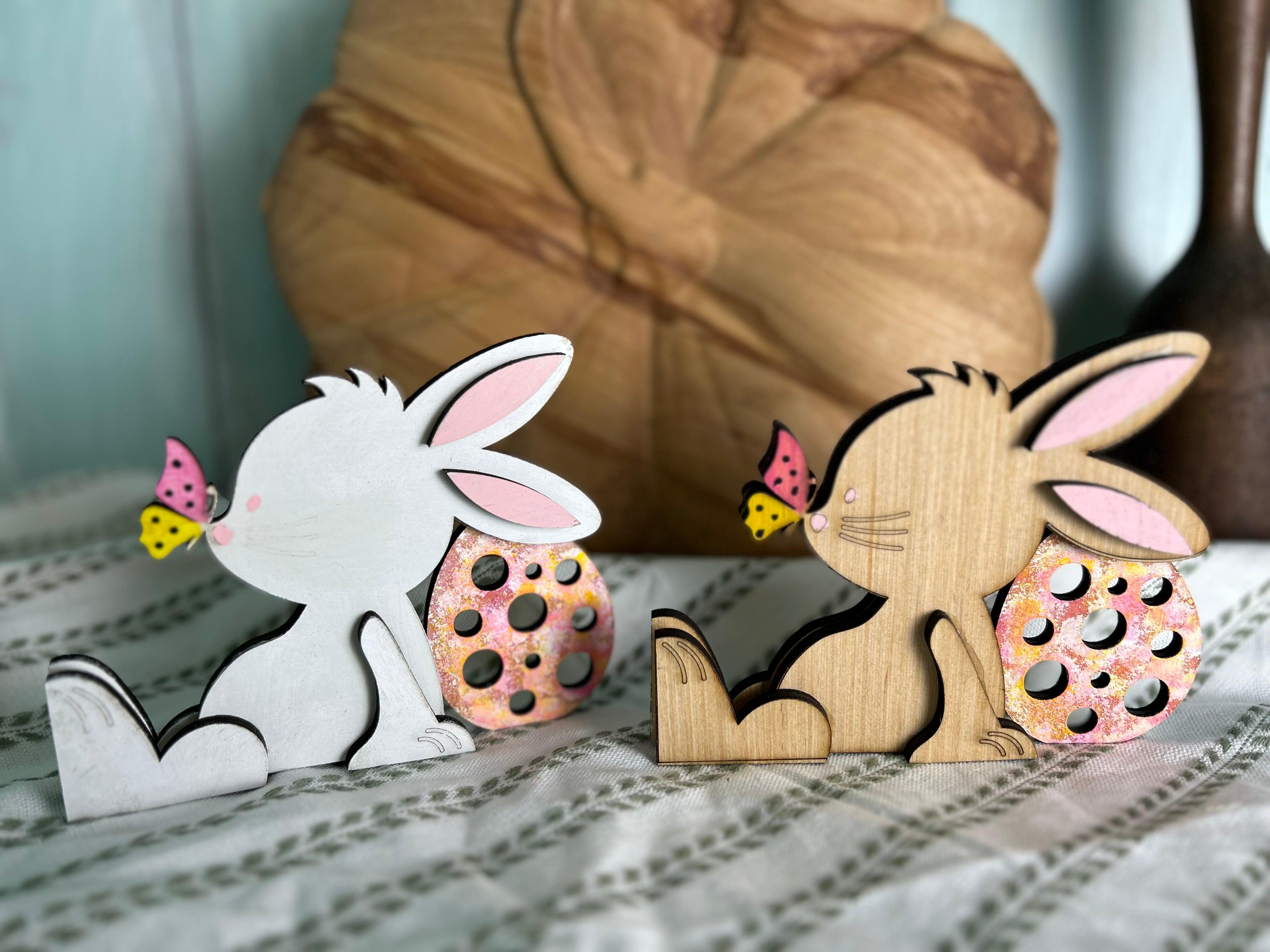 Handcrafted, hand-painted beige blonde wood bunny figurine with butterfly on nose and Easter egg