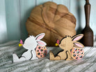 Handcrafted, hand-painted white blonde wood bunny figurine with butterfly on nose and Easter egg