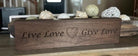 Hand-carved decorative walnut wood sign with intricate heart design