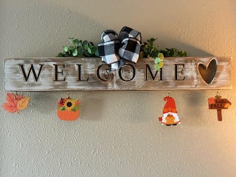 Handcrafted whitewashed pine carved welcome sign with all-seasons ornaments
