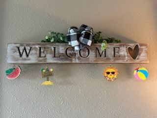 Handcrafted whitewashed pine carved welcome sign with all-seasons ornaments