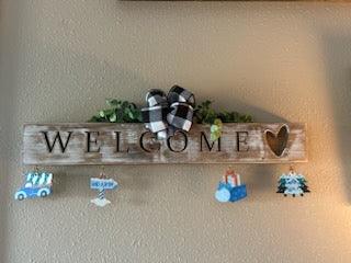 Handcrafted whitewashed pine carved welcome sign with all-seasons ornaments