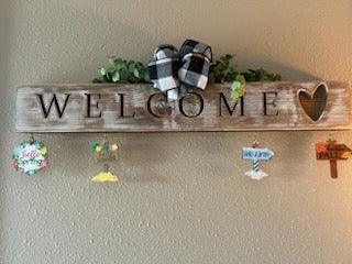 Handcrafted whitewashed pine carved welcome sign with all-seasons ornaments